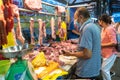 Buyer at the butcher stand in the morning wet market