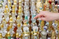 buyer chooses a bottle of oriental perfume at the bazaar Royalty Free Stock Photo