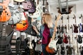 Choosing guitar in modern music store