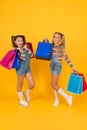 Buyer consumer concept. Total sale. Kids fashion. Holiday purchase saving. Home shopping. Small girls with shopping bags