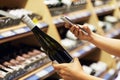 Buyer photographs a bottle of wine, a mystery shopper. Checking the quality of the goods by barcode