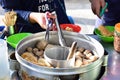 Buyer preparing meatballs food