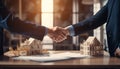 Buyer shaking hands with seller in house dealership. Choosing and buying house Royalty Free Stock Photo