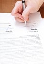 Buyer signs an agreement by silver pen Royalty Free Stock Photo