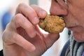 Castelnuovo don Bosco- 11/25/2018-A buyer smell a white truffle at annual truffle market