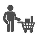 Buyer with trolley of goods solid icon, market concept, man holding shopping cart with purchases sign on white Royalty Free Stock Photo