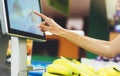 The buyer weighs the yellow bananas and points the fingers on the screen electronic scales, woman shopping healthy food Royalty Free Stock Photo