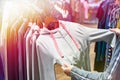 Buyer woman chooses clothes in store Royalty Free Stock Photo