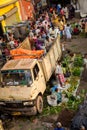 Buyers, sellers, vendors and porters throng a local market near Howrah bridge, Kolkata, India.