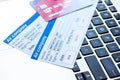 Buying airline tickets online with credit cards on keyboard background Royalty Free Stock Photo