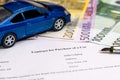 buying a car with euro, pen, calculator and toy car. Royalty Free Stock Photo