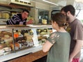 Buying cheese in a market