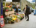 Buying flowers in London intersection street people florist