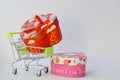 Buying gifts for Valentine's Day. Valentine's Day. Trolley with gifts on a white background