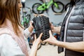 Buying new bicycle tire in the shop Royalty Free Stock Photo