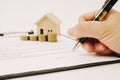 Close up of man signing rental agreement or sale purchase contract.Buying and renting new home concept. Royalty Free Stock Photo