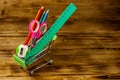 Buying school supplies. Shopping cart with school supplies on a wooden background. Back to school concept Royalty Free Stock Photo