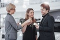 Buying their first car together. High angle view of young car salesman standing at the dealership telling about the Royalty Free Stock Photo