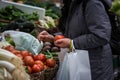 Buying tomatoes in a traditional fruit market Royalty Free Stock Photo