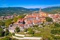 Buzet. Idyllic hill town of Buzet in green landscape aerial view