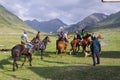 Buzkashi in Kyrgyzstan. Horse riders with sheep body.