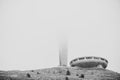 Buzludzha monument partially covered in mist