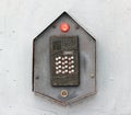 Buzzer door intercom on a grey wall Royalty Free Stock Photo