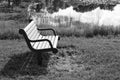 BW park bench by a lake