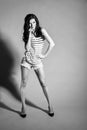 BW portrait of brunette beautiful girl posing in shorts Royalty Free Stock Photo