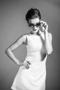 BW portrait of brunette beautiful girl posing in white dress Royalty Free Stock Photo
