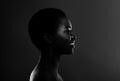 Bw Profile Portrait Of Smiling Black Woman In Backlit Over Dark Background