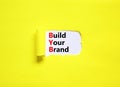 BYB build your brand symbol. Concept words BYB build your brand on white paper on a beautiful yellow background. Business and BYB Royalty Free Stock Photo