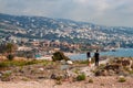 BYBLOS, LEBANON - AUGUST 15, 2014: Unknown tourists walking on the ancient ruins of the historic city of Byblos. Royalty Free Stock Photo