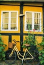 Bycicle on a brick yellow wall