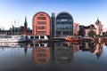 Bydgoszcz, Poland - the New Granaries by the Brda river with water reflections at sunrise.