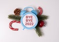 Bye Bye 2022 alphabet letters and christmas decoration on white background. Royalty Free Stock Photo