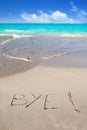 Bye spell written in beach sand tropical Caribbean Royalty Free Stock Photo