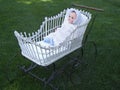 old doll in vintage buggy Royalty Free Stock Photo