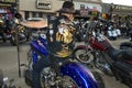 A byker parking his chopper motorcycle in the main street of the city of Sturgis, during the annual Sturgis Motorcycle rally