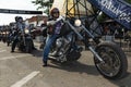 A byker riding his chopper motorcycle during the annual Sturgis Motorcycle rally in the main street of the city of Sturgis Royalty Free Stock Photo