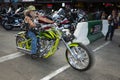 A biker riding his chopper motorcycle during the annual Sturgis Motorcycle rally in the main street of the city of Sturgis