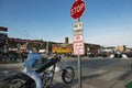 A byker waiting at a stop sign during the annual Sturgis Motorcycle rally in the main street of the city of Sturgis