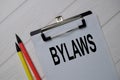 Bylaws write on a paperwork isolated on wooden table