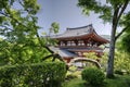 Byodo-in temple between trees in Uji, Japan Royalty Free Stock Photo