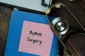 Bypass Surgery write on sticky notes isolated on Wooden Table. Medical or Healthcare concept