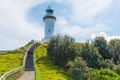 Ocean view over Cape Byron lighthouse, the Most Easterly Point on the Australian Mainland with green turquoise water waves in Byro Royalty Free Stock Photo