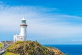 Ocean view over Cape Byron lighthouse, the Most Easterly Point on the Australian Mainland with green turquoise water waves in Byro