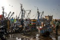 Bystanders watch as fishermen unload their catch from a trawler at the busy harbour at Essaouira in Morocco.