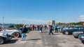 Bystanders watching old cars