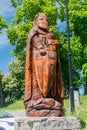 Wooden sculpture next to Bytow castle of gothic Teutonic castle and a former stronghold for Pomeranian dukes